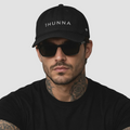 Black Casual Dad Hat with light 1HUNNA branding – front worn view