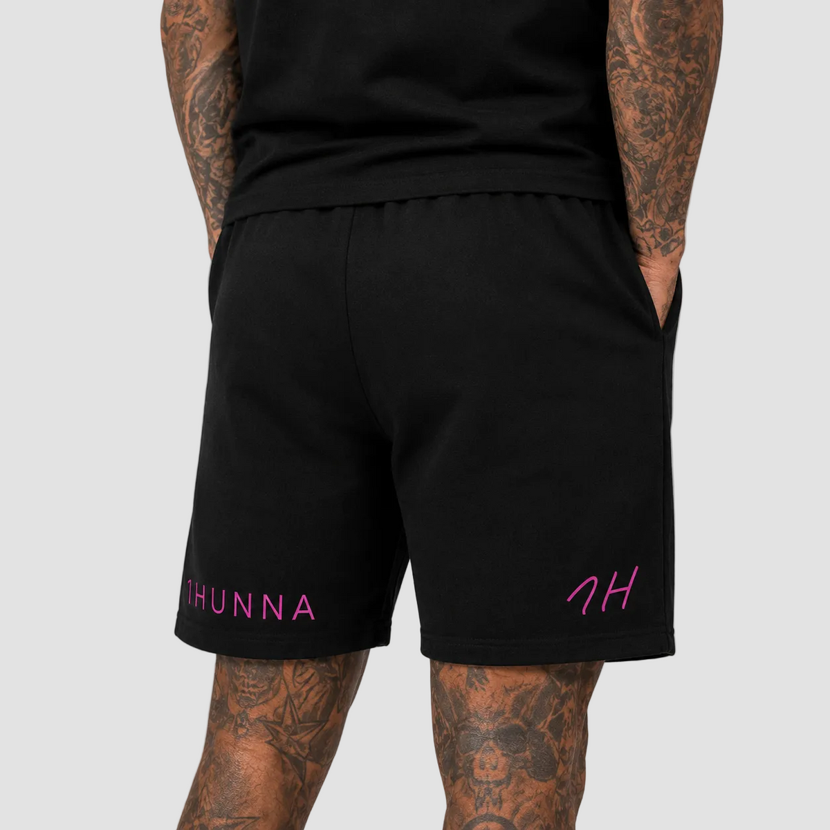 Black Casual Athletic Shorts – second worn view with pink leg branding